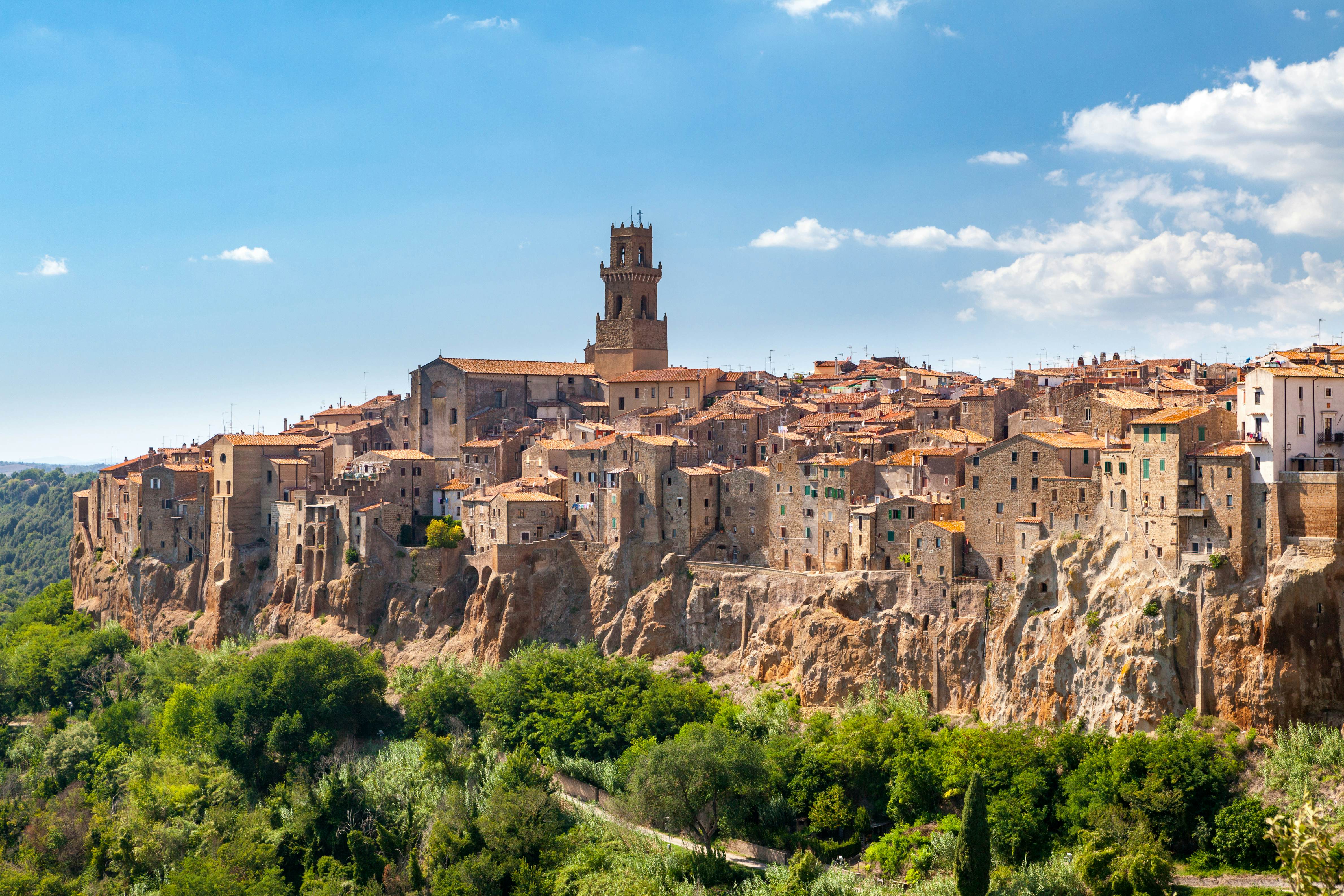 A red-brick Tuscan town built into the side of a ridge. 