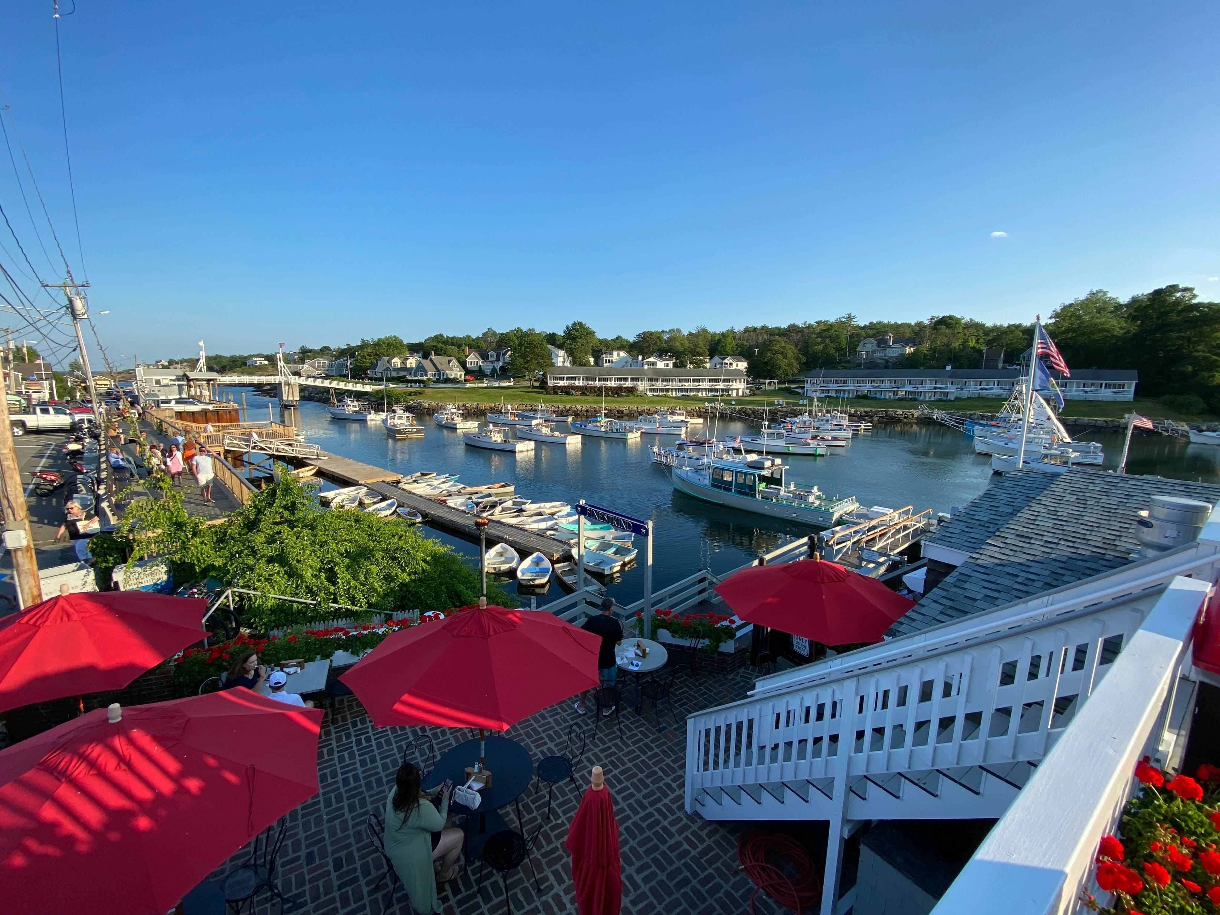 July 20, 2022:Ogunquit, Maine-USA: A high shot of Perkins Cove of fishing boats and visitors in summertime., License Type: media, Download Time: 2024-09-09T04:38:05.000Z, User: Norma.PrauseBrewer_LonelyPlanet, Editorial: true, purchase_order: 56530, job: Global Publishing WIP, client: New England 11, other: Norma Brewer