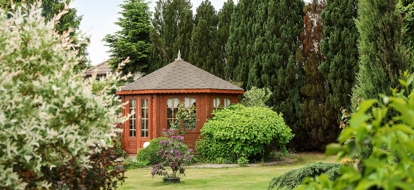 Picturesque view of gazebo in beautiful garden on sunny day